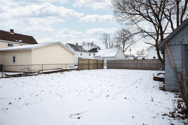 view of yard layered in snow