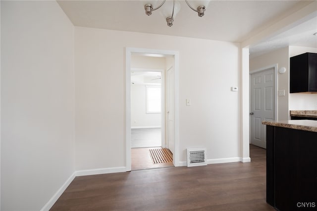 unfurnished dining area with dark hardwood / wood-style floors