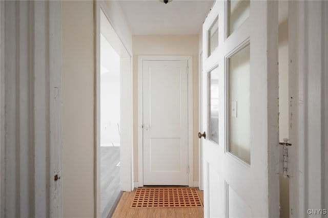 doorway to outside featuring wood-type flooring