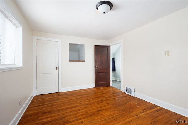 unfurnished bedroom featuring hardwood / wood-style floors