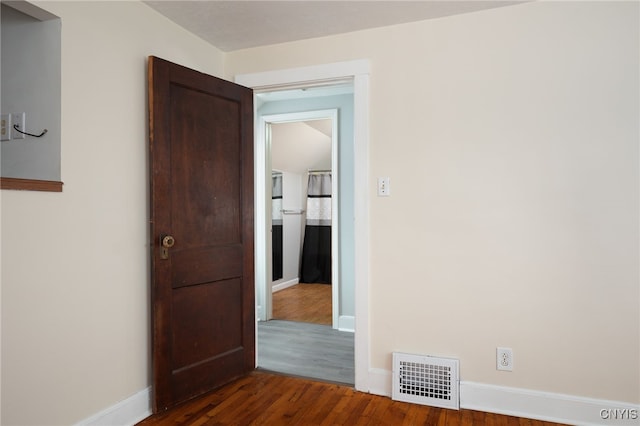 hallway featuring dark hardwood / wood-style floors