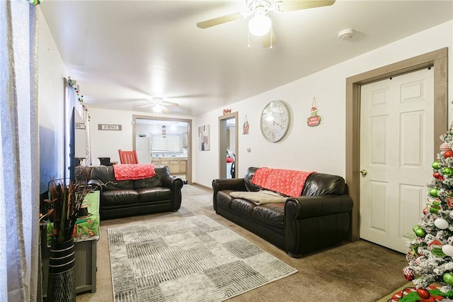 living room featuring ceiling fan and carpet floors