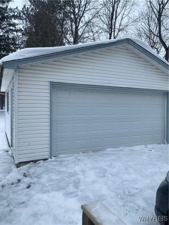 view of snow covered garage