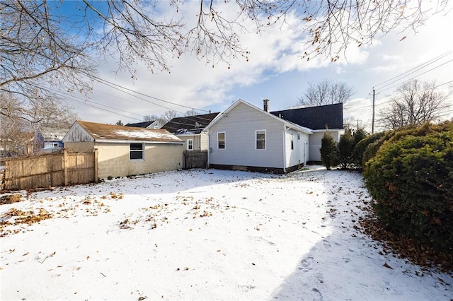 view of snow covered house