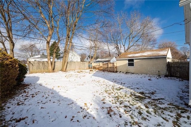 view of yard layered in snow