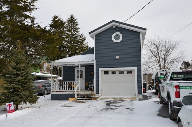 view of front of home featuring covered porch and a garage