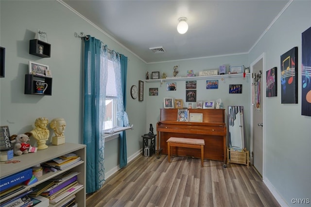 43804 Second St, Alexandria, NY 13679 - sitting room with wood finished floors, crown molding, and baseboards
