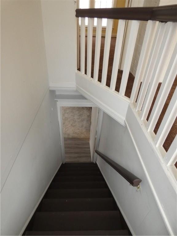 stairs with wood-type flooring