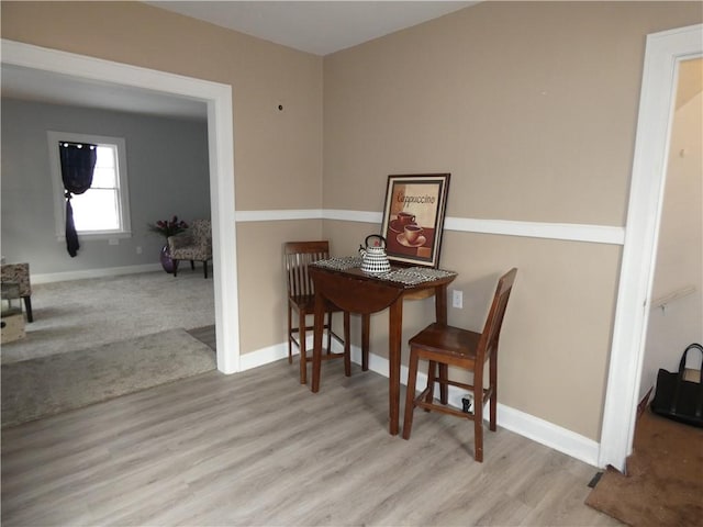 dining area with light hardwood / wood-style flooring