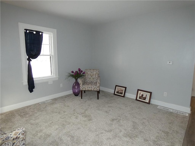 unfurnished room with light carpet