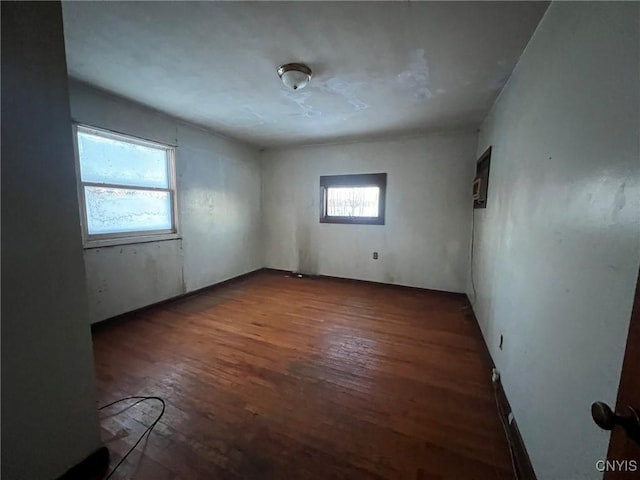 unfurnished room featuring dark hardwood / wood-style floors