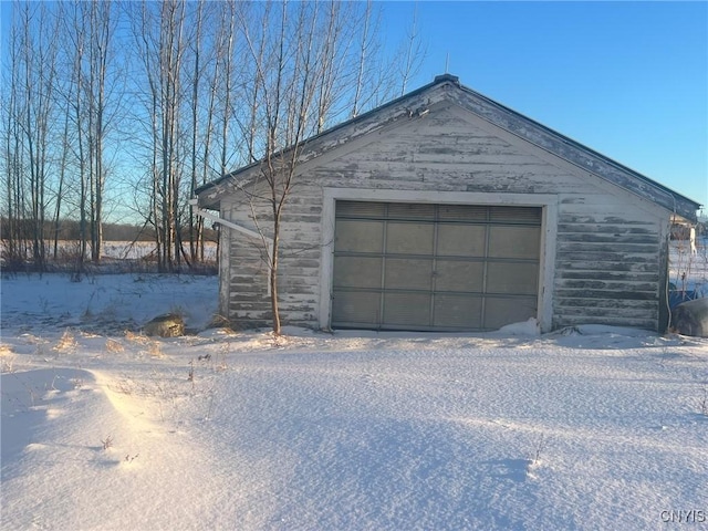 view of snow covered garage