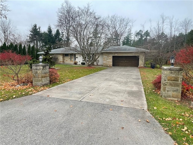 single story home featuring a front yard and a garage