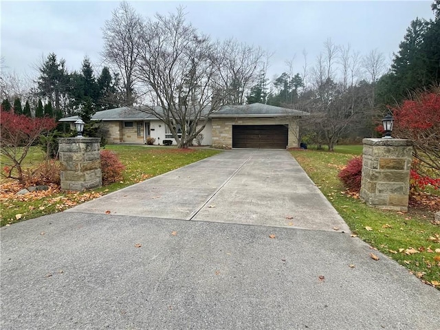 view of front of house featuring a front yard and a garage