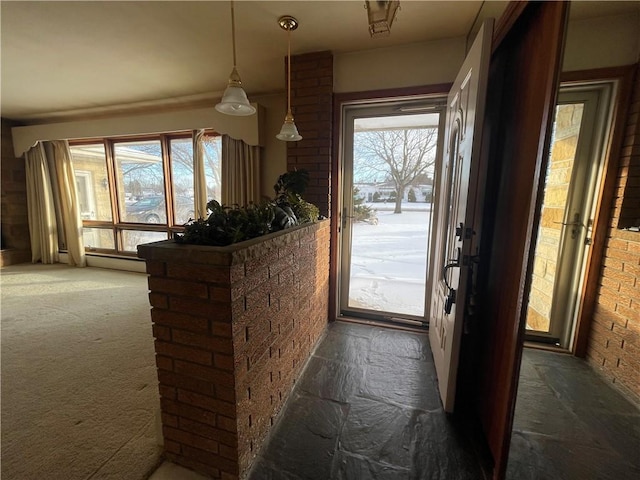 doorway featuring dark colored carpet