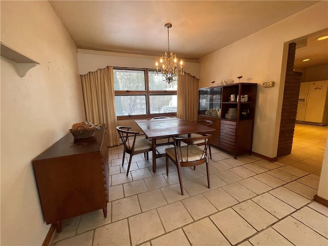 dining area featuring a notable chandelier