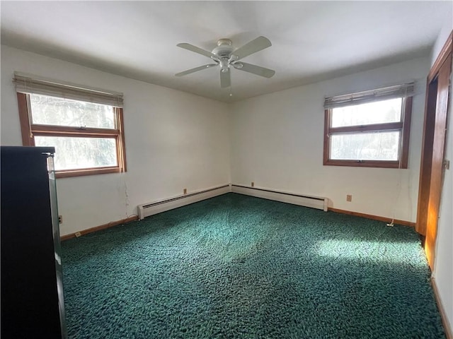 unfurnished room featuring carpet flooring, ceiling fan, and baseboard heating