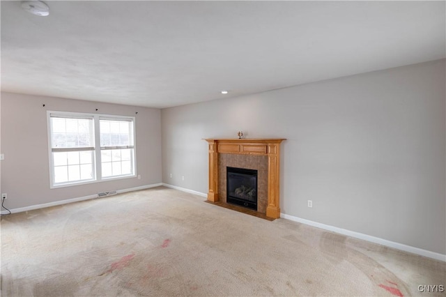 unfurnished living room featuring light carpet