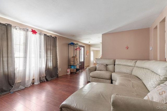 living room with dark hardwood / wood-style flooring