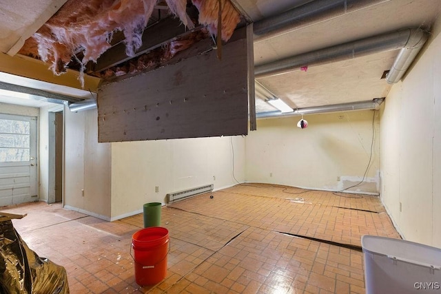 garage featuring a baseboard heating unit