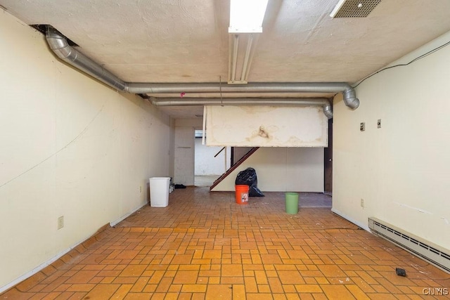 basement with a baseboard heating unit