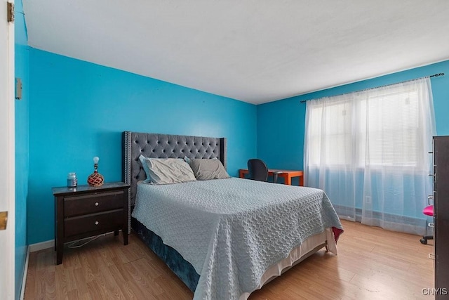 bedroom with light hardwood / wood-style flooring