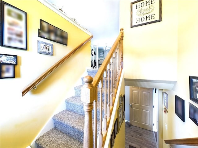 staircase featuring hardwood / wood-style floors