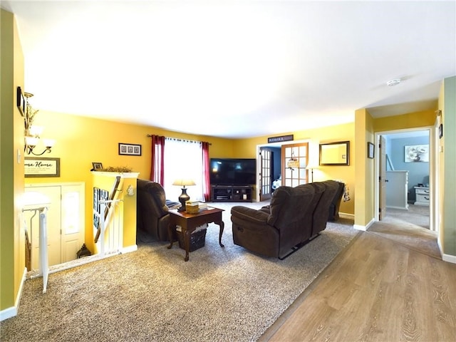 living room featuring french doors and wood-type flooring