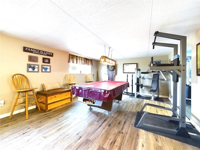 game room featuring wood-type flooring, billiards, and a paneled ceiling