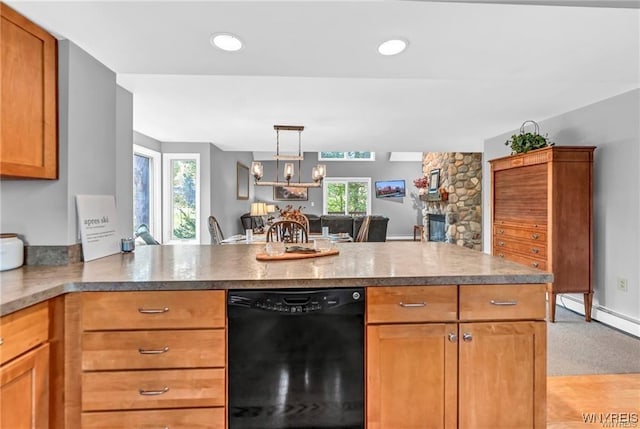 kitchen with a stone fireplace, a baseboard radiator, a peninsula, black dishwasher, and open floor plan