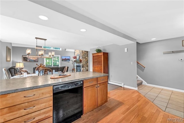 kitchen with hanging light fixtures, baseboard heating, light wood-type flooring, dishwasher, and baseboards