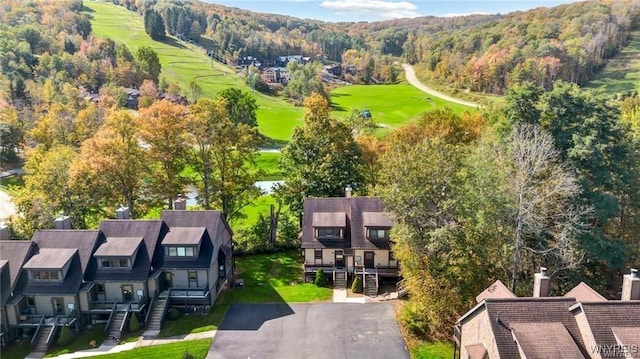 aerial view featuring view of golf course and a residential view