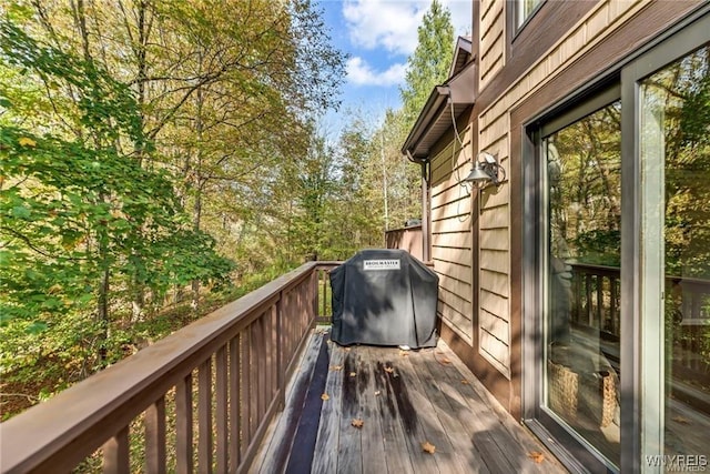 wooden terrace with area for grilling