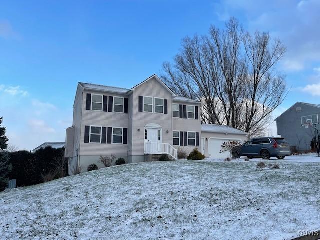 view of front of property with a garage