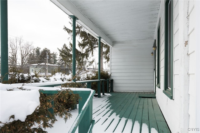 view of snow covered deck