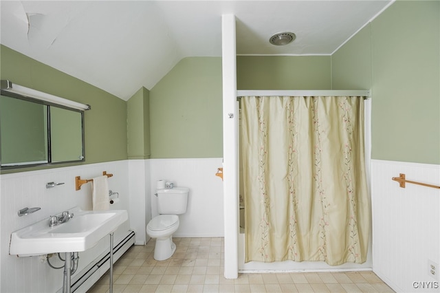 full bathroom featuring lofted ceiling, a baseboard heating unit, sink, toilet, and shower / tub combo