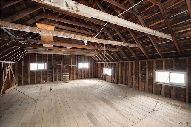 attic featuring a wealth of natural light