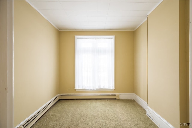 unfurnished room featuring ornamental molding, carpet floors, and a baseboard heating unit