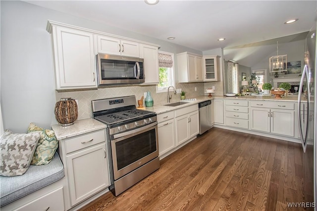 kitchen featuring white cabinetry, sink, and appliances with stainless steel finishes