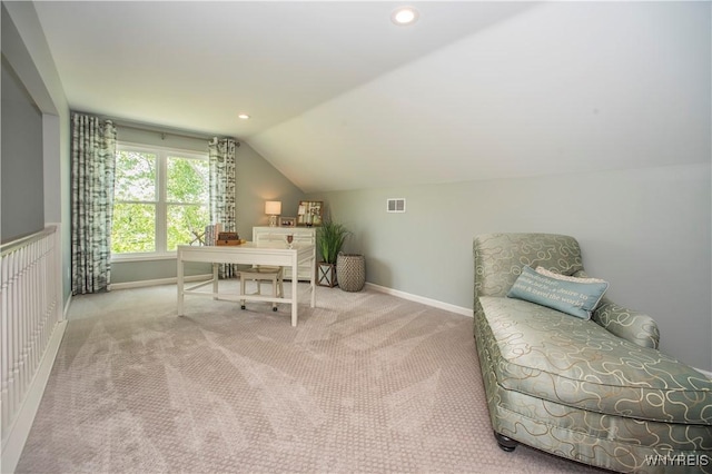 carpeted office space with vaulted ceiling