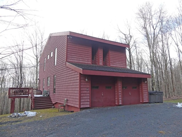 view of side of home featuring a wooden deck