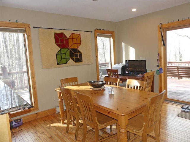 dining space with light wood-type flooring