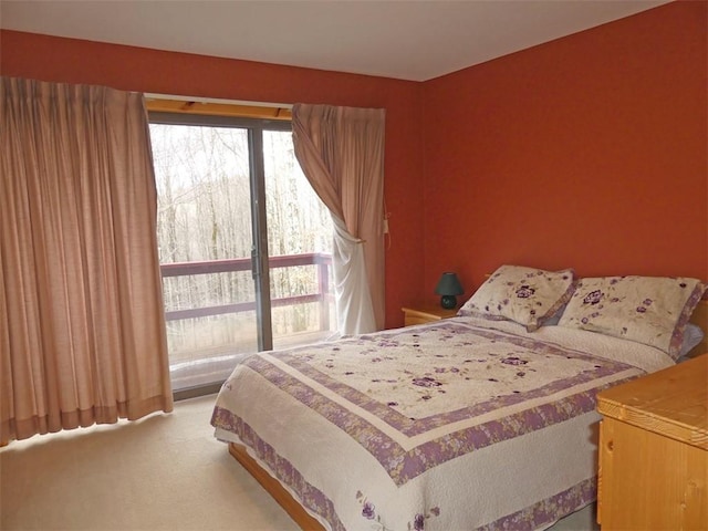 bedroom featuring light carpet