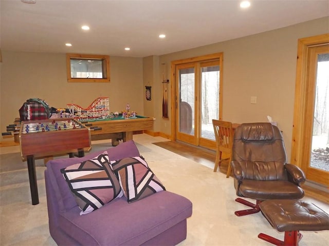 recreation room featuring light colored carpet