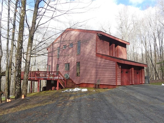 view of side of property with a deck