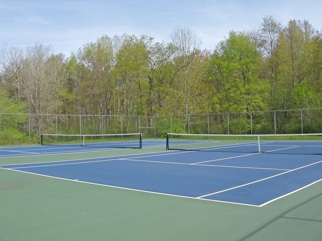 view of sport court with basketball hoop