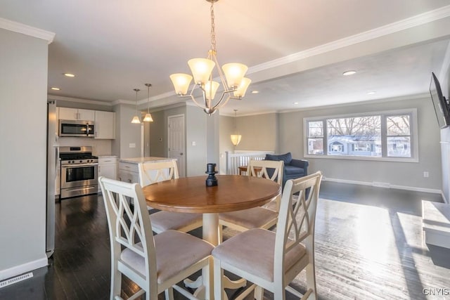 dining room with dark wood-type flooring, crown molding, and a chandelier