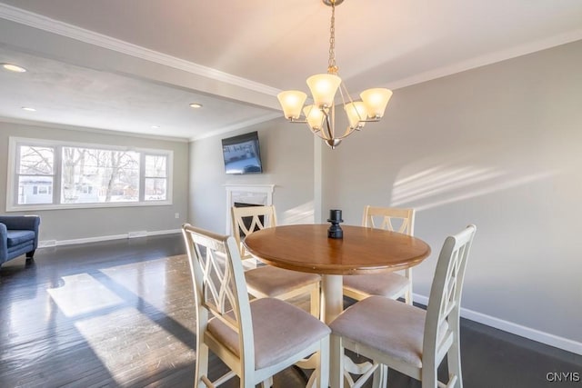 dining room with a chandelier, dark hardwood / wood-style floors, and crown molding