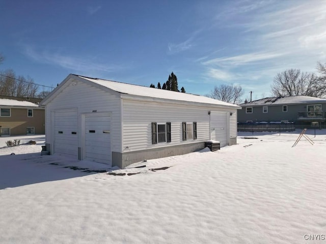 exterior space featuring an outbuilding and a garage