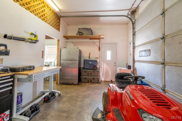 garage with stainless steel fridge